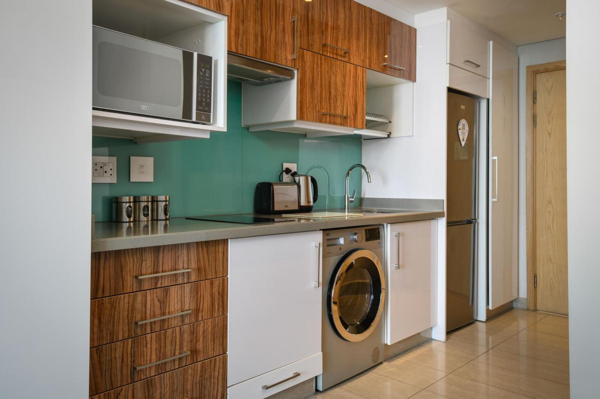 The Capital Pearls Hotel Дърбан Екстериор снимка A typical kitchen in a serviced apartment