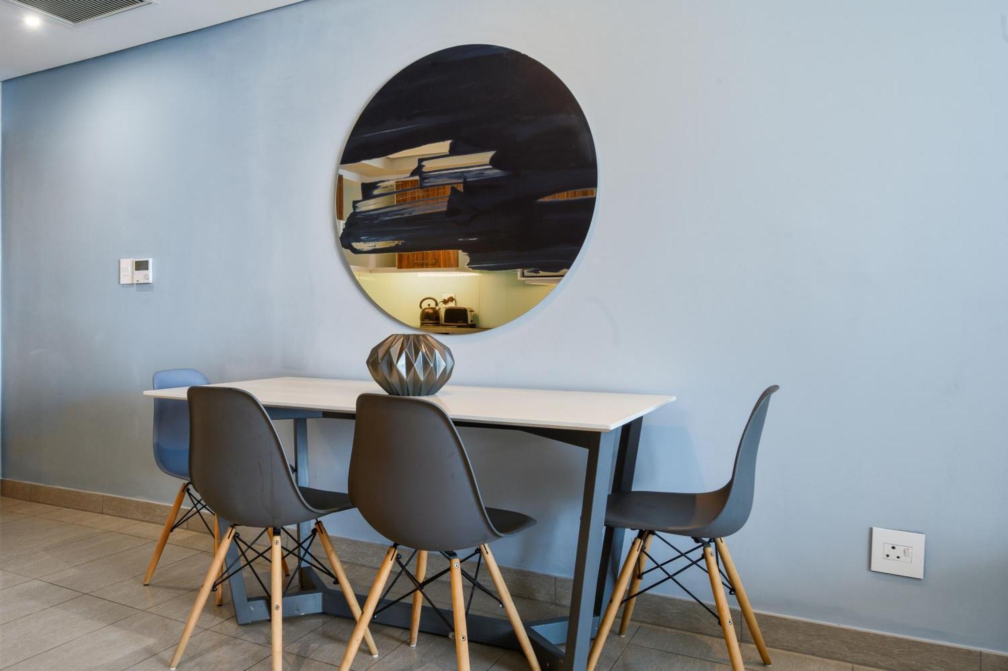 The Capital Pearls Hotel Дърбан Екстериор снимка A dining room with a table and chairs
